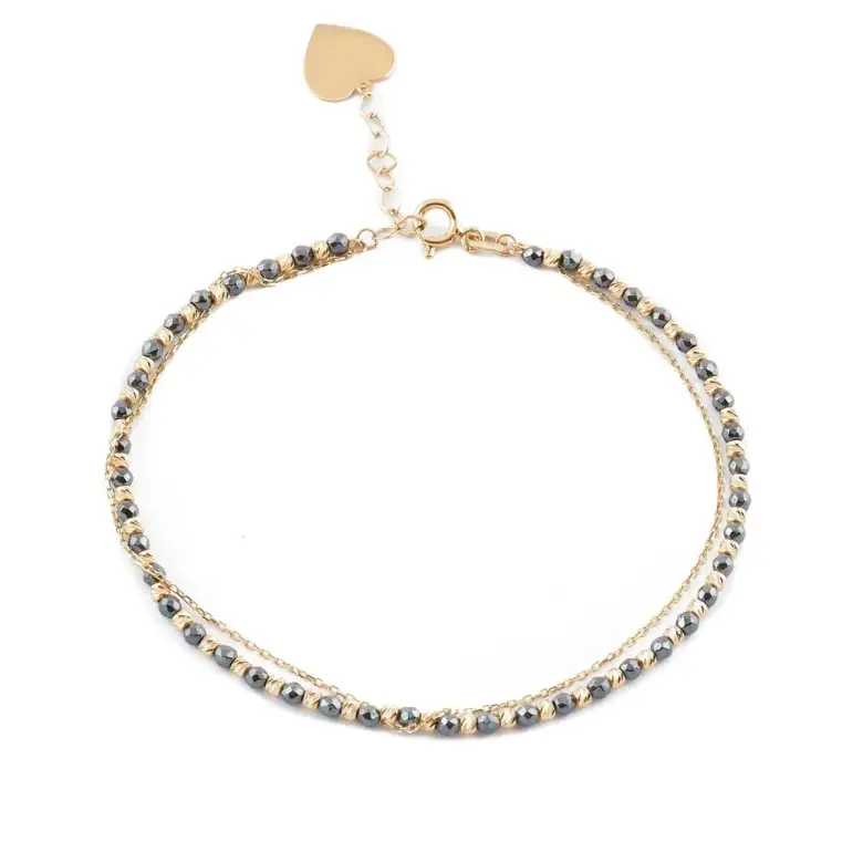 Złota bransoletka z czarnymi kamyczkami Złota bransoletka z czarnymi kamyczkami